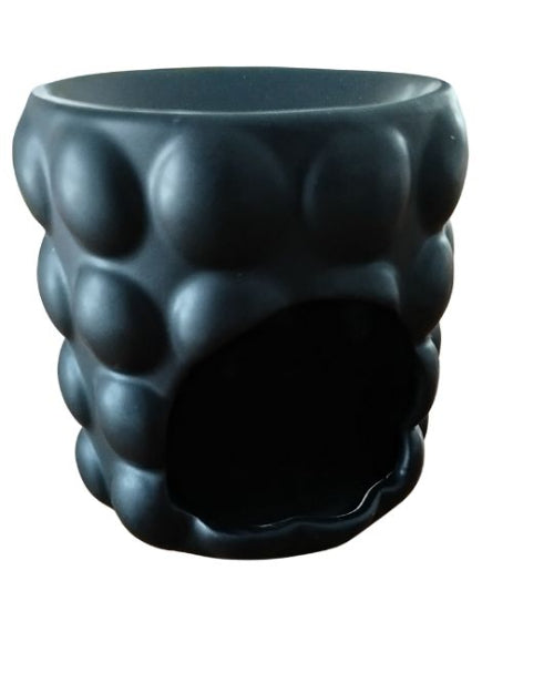 Vue rapprochée du Brûleur Bubble noir pour Fondants parfumés en céramique noire, montrant la texture à bulles et la finition mate élégante.