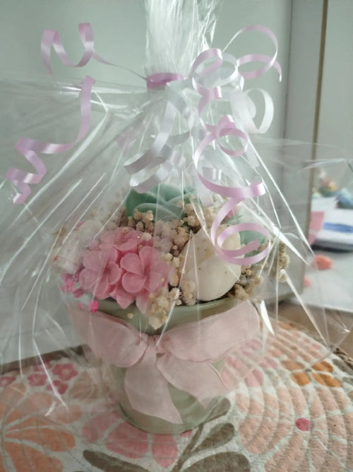 Bouquet de fondants parfumés en cire présenté avec un élégant nœud rose prêt à offrir