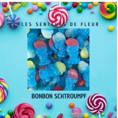 Fondant parfumé bonbon schtroumpf avec des bonbons colorés en forme de Schtroumpf sur un fond joyeux.